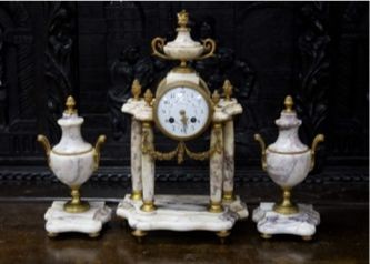 A late 19th century French three piece clock set, in Louis XVI taste with key and pendulum 42cm